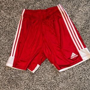 Red Adidas athletic shorts. Size medium.